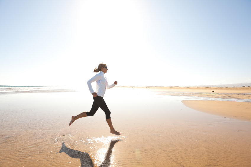 A woman running on the beach